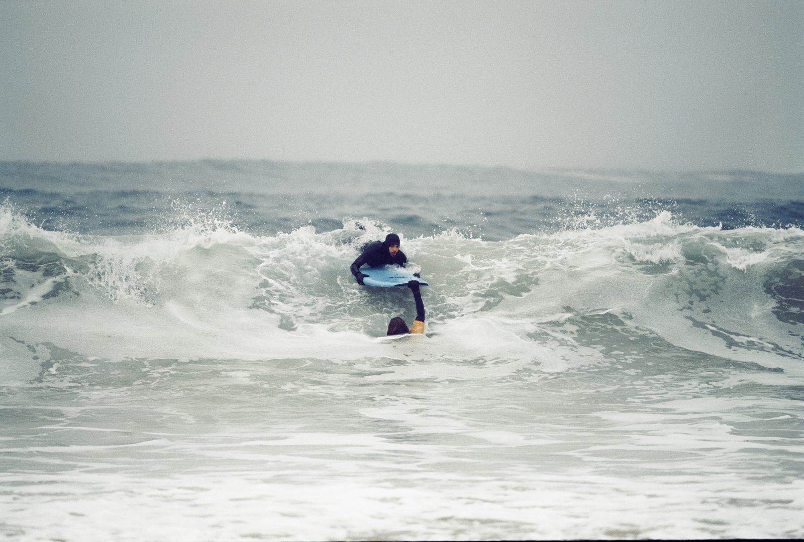 Promise — surfer in the wild North Sea
